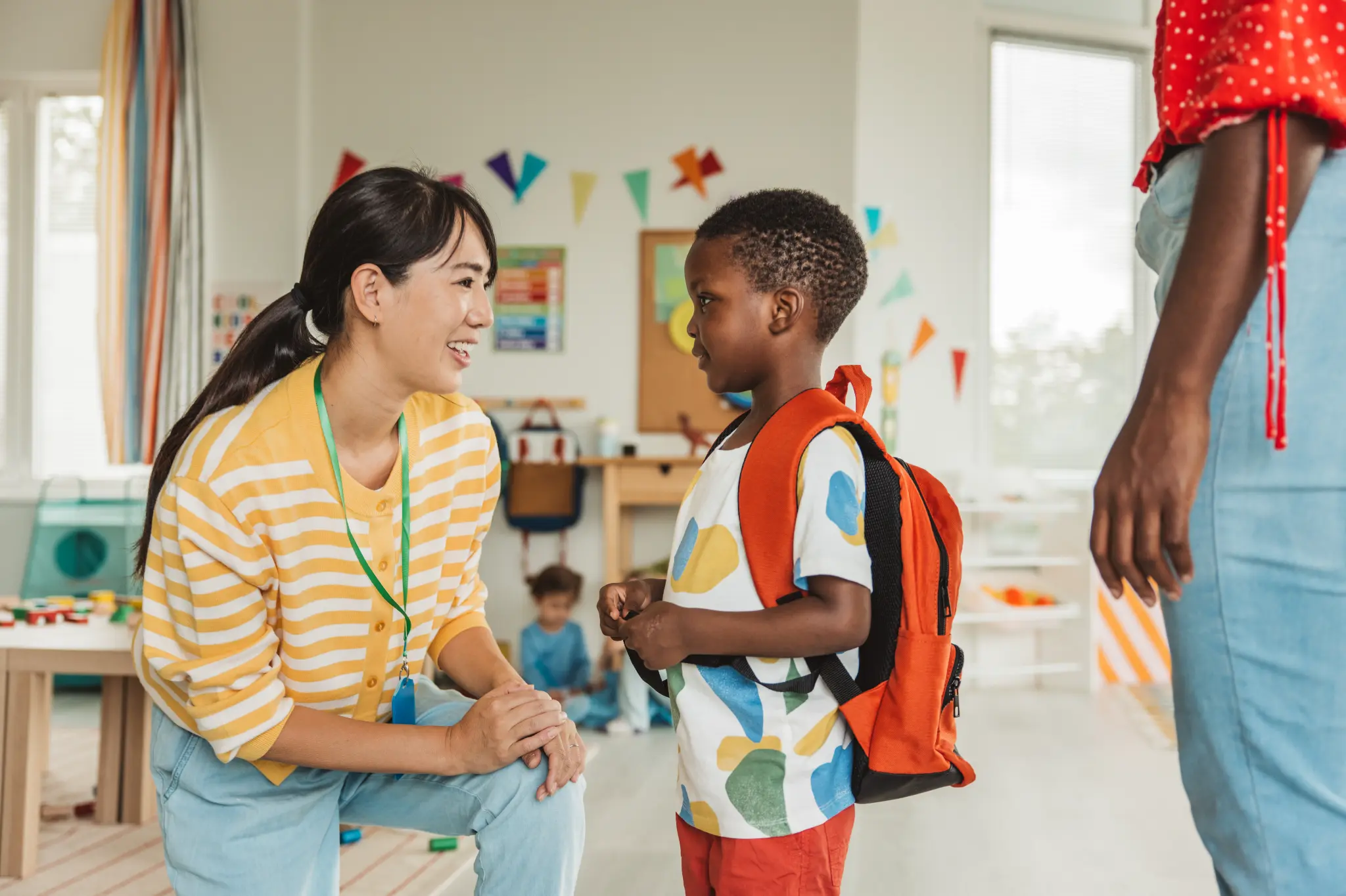 Teacher interacting with student in classroom
